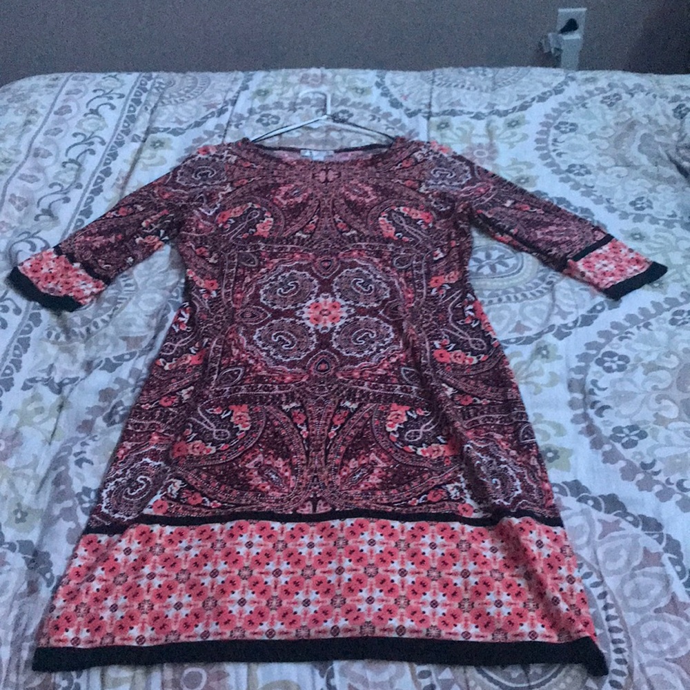 An orange and black silky dress💞